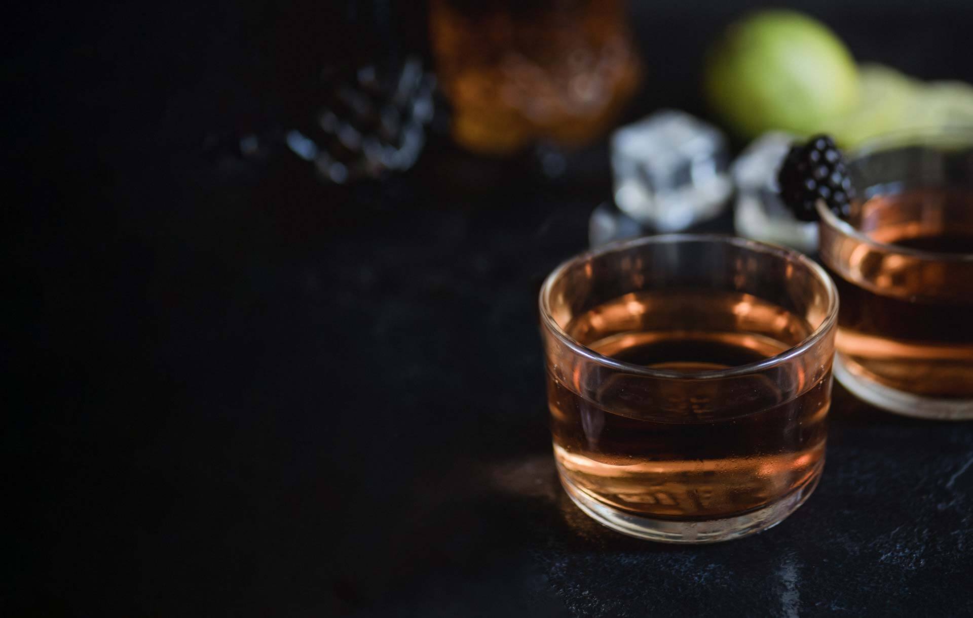 Close detail of a bartender finishing a stirred drink
